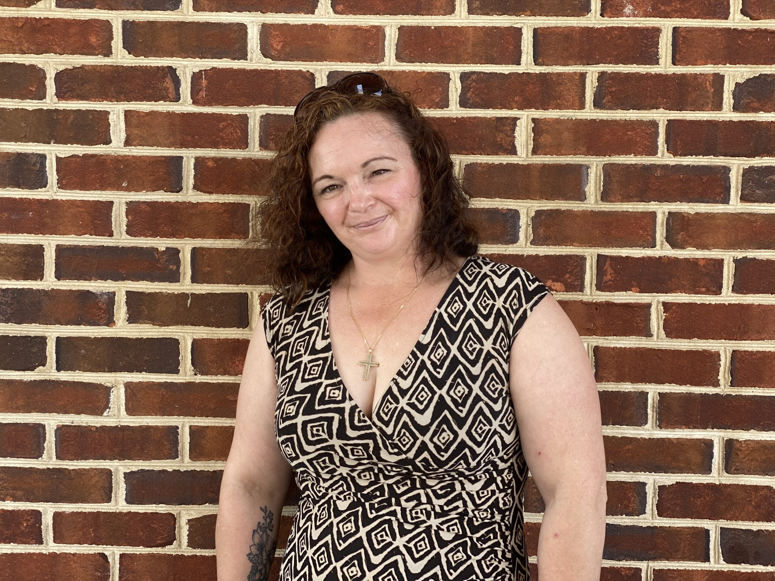 Emily Forrester against a brick background