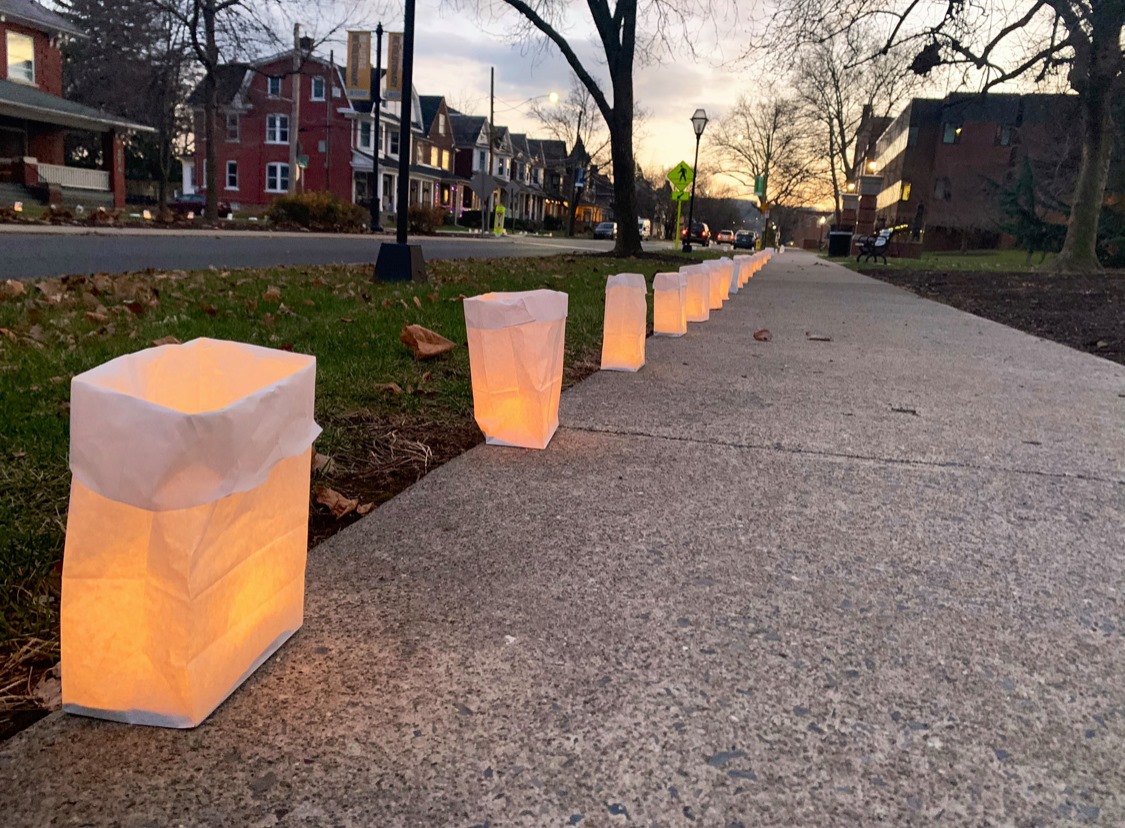 Luminaria Kits lining a sidewalk 