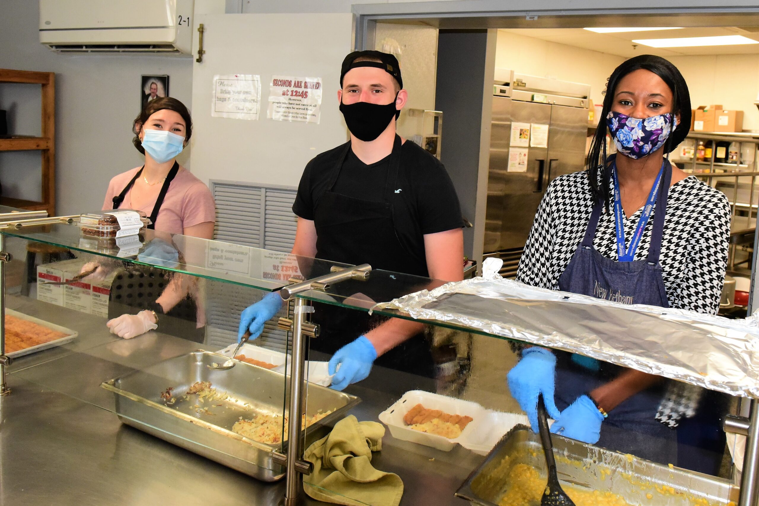 3 volunteers at a soup kitchen