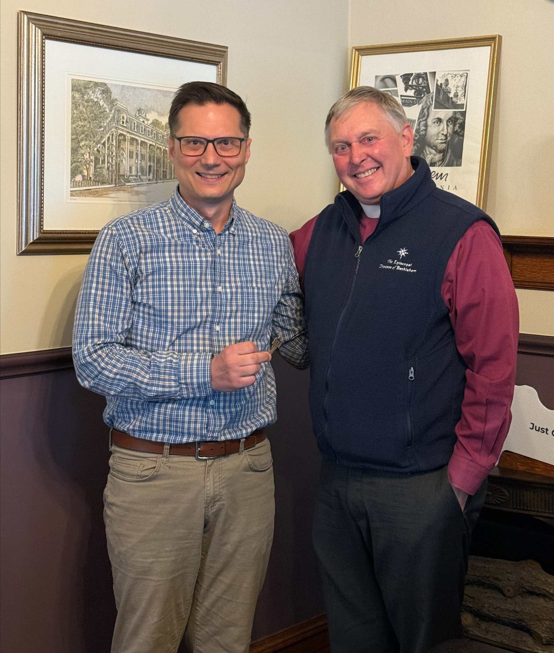 Marc Rittle receiving the key from Bishop Kevin Nichols.